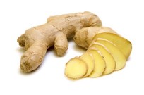 A whole and chopped ginger plant on a white background.