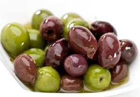 A bowl of black and green olives.