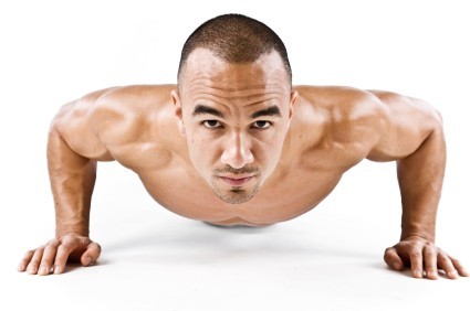 A close up of a man doing a pressup.