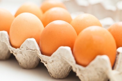 A close up shot of a box of eggs.