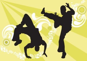 Two cartoon Capoeira dancers.