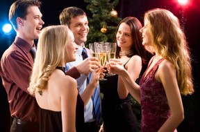 A group of people enjoying a Christmas party.