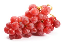 A bunch of red grapes on a white background.