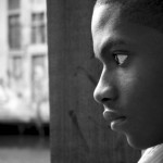 A young boy with a scared expression on his face.