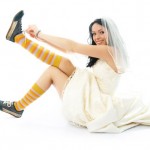 A bride wearing sports shoes.